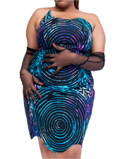 Woman wearing a blue and purple patterned dress with sheer black gloves on a white background